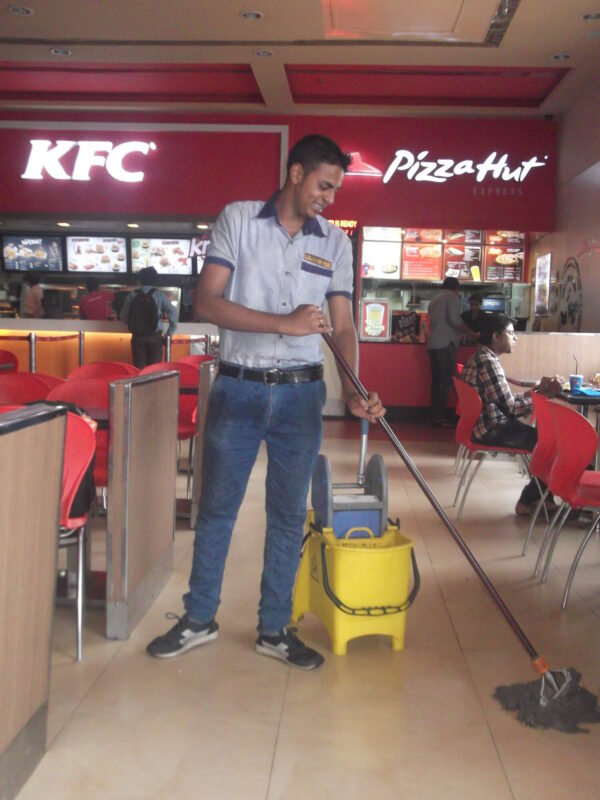 Professional housekeeping staff maintaining cleanliness in office – Security Guard Services in Kolkata by Legend Hide Pvt. Ltd.